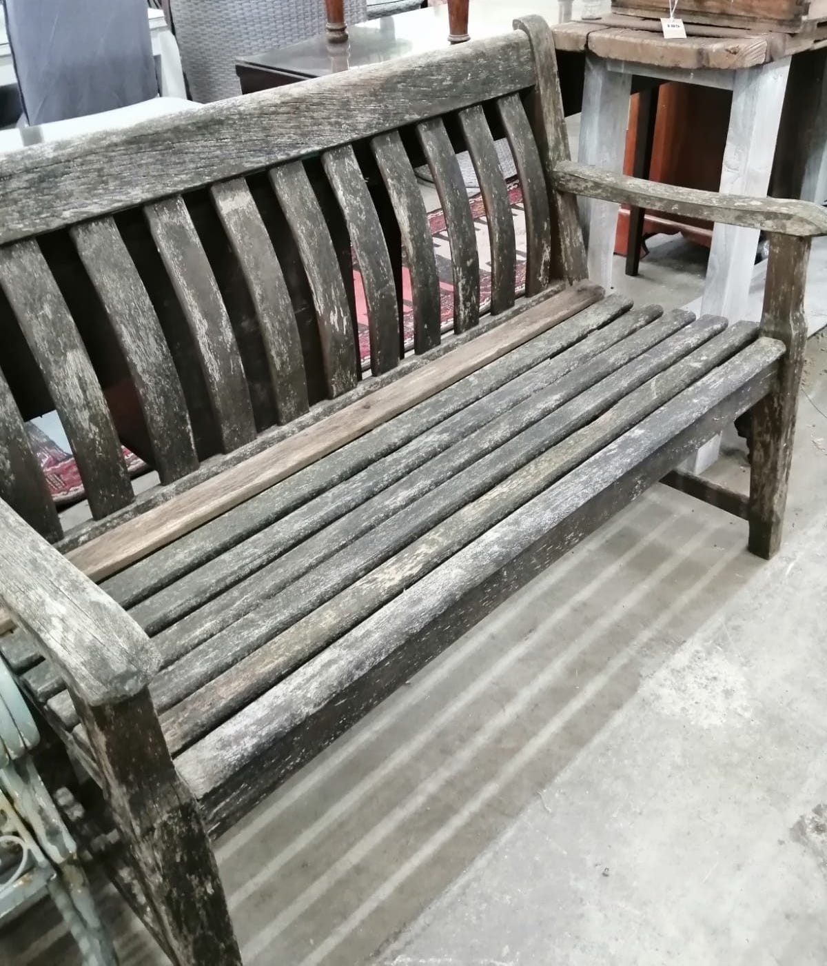 An Alexander Rose weathered teak garden bench, width 124cm *Please note the sale commences at 9am.